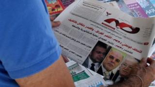 Man reads Iraqi newspaper Khabar