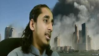 Afsor Ali in front of images of the Twin Towers