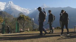 Trekkers looking at peaks