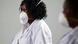 Kenyan health workers at the international airport in Nairobi, Kenya