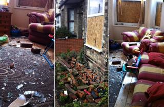 Glass and bricks strewn across the Wilson's living room