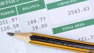 Payslip and pencil