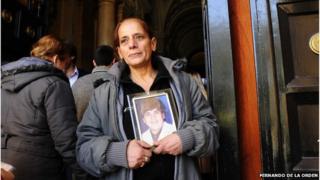 Nelida Serpico holds a picture of her son
