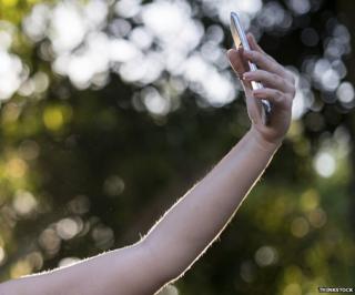 Woman taking a selfie