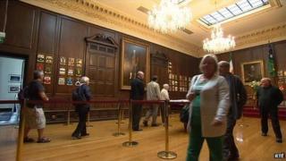 Members of the public file past Mr Reynolds' coffin in Mansion House in Dublin