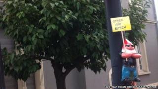 "Coolman" gnome used by Austria's left wing Social Democrat Party is tied to a lamppost ahead of provincial elections (August 2014)