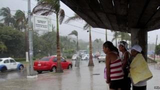 Residents shelter from heavy rain brought by hurricane Marie, in Puerto Vallarta, Jalisco state on 24 August 2014
