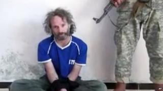 A still from a video of journalist Peter Theo Curtis taken during his imprisonment by al-Qaeda affiliates