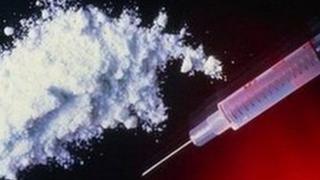 Powder and a syringe