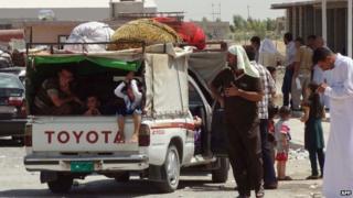 Displaced Shia Kurds from the Mosul area on the Kirkuk-Irbil road - 8 August