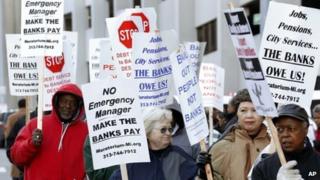 Protesters rally outside a Detroit, Michigan, court on 23 October 2014