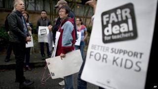British Columbia Teacher Federation (BCTF) President Jim Iker, left, joined supporters outside the Britannia Secondary and Elementary Schools in Vancouver, British Columbia 2 September 2014