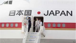 Japanese Prime Minister Shinzo Abe prepares to get off his plane upon his arrival in Port of Spain, Trinidad and Tobago on 27 July 2014.