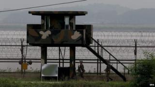 South Korean soldiers patrol at the border with North Korea near the Demilitarized Zone (DMZ) on 14 August 2014