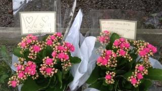 Flowers outside the home of the al-Hilli family in Claygate, Surrey