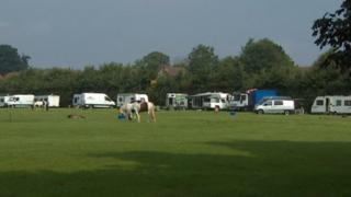 Travellers in field