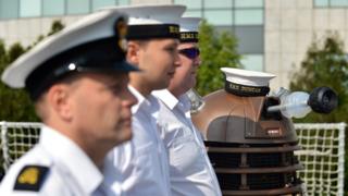 The Dalek stands in line