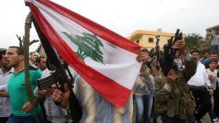 Gunmen at the funeral of a Lebanese soldier who was beheaded by Islamic State militants in Akkar, north Lebanon - 3 September 2014