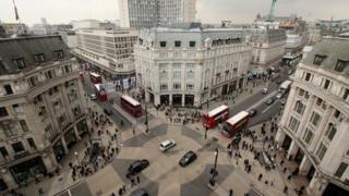 Cars and buses at the junction of Oxford Street and Regent Street