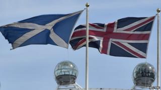 The Scottish saltire flag (L) and Union flag fly outside the Scottish Office, in central London August 28, 2014.