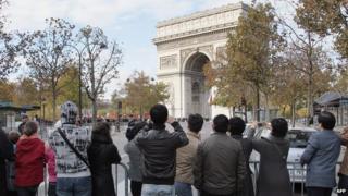Chinese tourists in front of the Arc de Triomphe in Paris