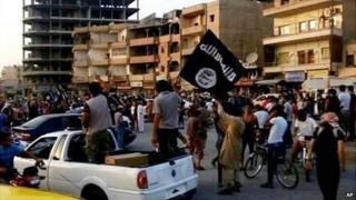 Islamic State militants in Raqqa (file photo)