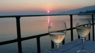 Wine glasses at sunset