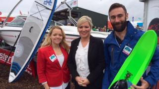 Michelle O'Neill (centre) with Jonathan Crawford and Samantha Crawford from Mastercraft Ireland