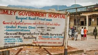 A sign board showing directions to the Lumley Government Hospital, where medical doctor Olivet Buck worked before contracting the Ebola virus and passing away on Saturday near the city of Freetown, Sierra Leone, 15 September 2014