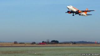 Plane landing at Inverness Airport