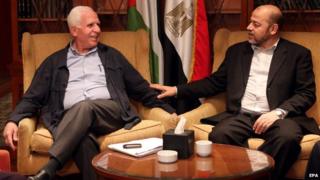Member of Palestinian Fatah party, Azzam al-Ahmad (L), meets with Hamas politburo member Musa Abu Marzouk (R) at a hotel in Cairo, Egypt, 24 September 2014