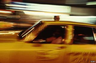 Blurred picture of 1970s NY cab driving at night