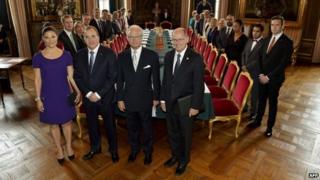 Sweden's new government poses together with front from left, Crown Princess Victoria, Prime Minister Stefan Lofven, King Carl Gustaf and parliament Speaker Urban Ahlin during a cabinet meeting at the Royal Palace in Stockholm (2 October 2014)