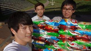 Korean students with their crisp packet boat