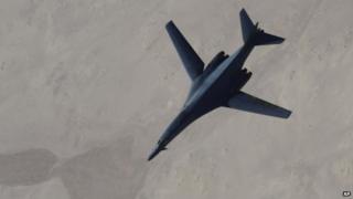 Photo released by the US Air Force, a B-1B Lancer disengages from a KC-135 Stratotanker after refuelling during US-led air strikes on Islamic State group targets in Syria on 27 September 2014