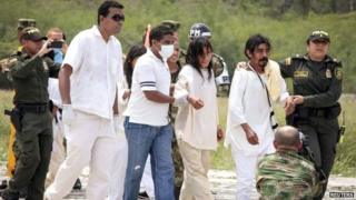 Colombian rescue workers and troops with Wiwa indigenous survivors