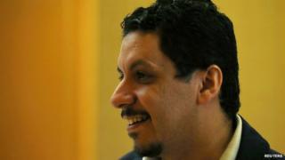 Yemeni politician Ahmed Awad bin Mubarak speaks to journalists as he enters a hotel in Sanaa September 27, 2014