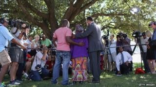 Rev. Jesse Jackson (R) stands with Nowai korkoyah (C) the mother of Ebola patient Thomas Eric Duncan, as well as his nephew, Josephus Weeks 7 October 2014