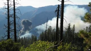 Smoke rises from a plane crash in Yosemite National Park in California on 7 October 2014