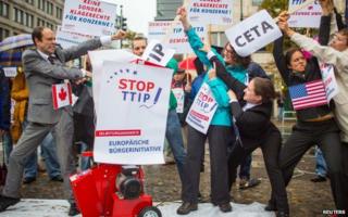 Activists protest against the TTIP and CETA in Berlin on 11 October 2014