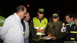 Mayor of Cali Dr Rodrigo Guerrero with police officers in the city of Cali