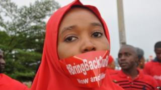 A woman attends a demonstration in Abuja, Nigeria, on 11 September 2014, calling on the government to rescue the kidnapped girls of the government secondary school in Chibok.