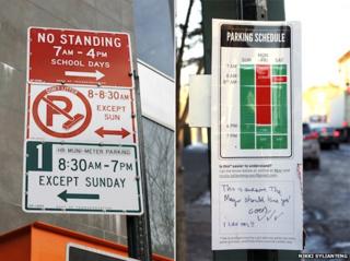 New York street sign (left) improved by Nikki Sylianteng (right)