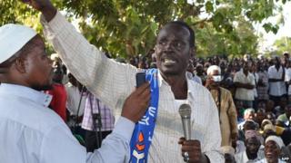 Mombasa Republican Council (MRC) Chairman, Omar Mwamnuadzi (C) gesticulates after the burial of his first wife in Ng'ombeni, Kwale county, 40 kilometres (25 miles) south of the port city of Mombasa on 3 March 2012