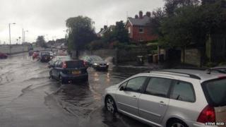 Traffic is moving slowly on Finaghy Road North in Belfast due to heavy rain