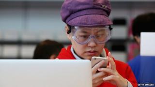 Chinese woman using a smartphone