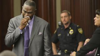 Ron Davis, the father of Jordan Davis, wipes away tears after reading his victim's impact statement to the court, during Michael Dunn's sentencing hearing 17 October 2014