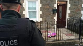 A police officer at the house where the alleged attack happened