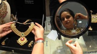 Indian woman trying on jewellery