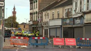 Police patrols and road closed signs on Freeman Street